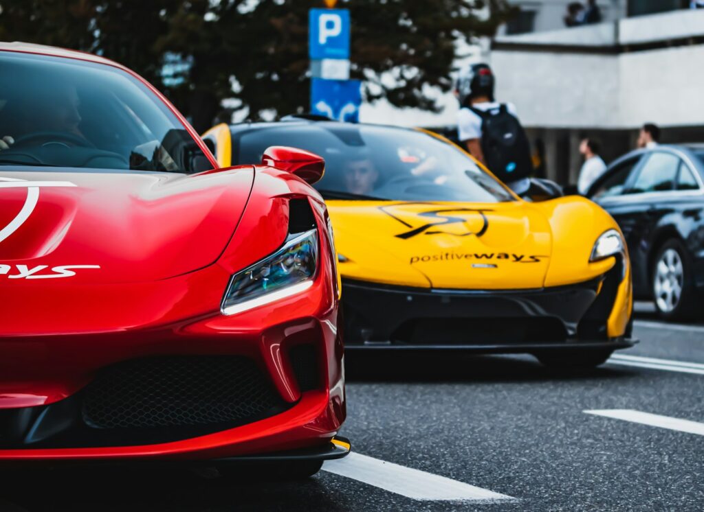 red ferrari 458 italia on road during daytime